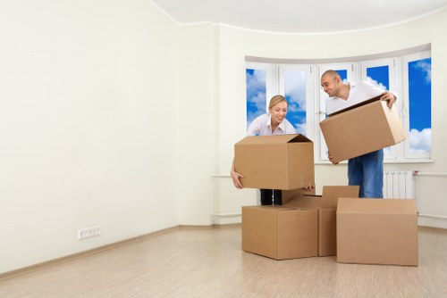 Unpacking boxes in a Woodside Park home after relocation