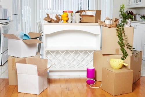 Packed boxes and furniture ready for local removals in Woodside Park