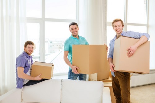 Loading furniture and boxes into a van in a North London residential area