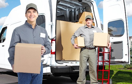 Professional movers handling access challenges on a Woodside Park street