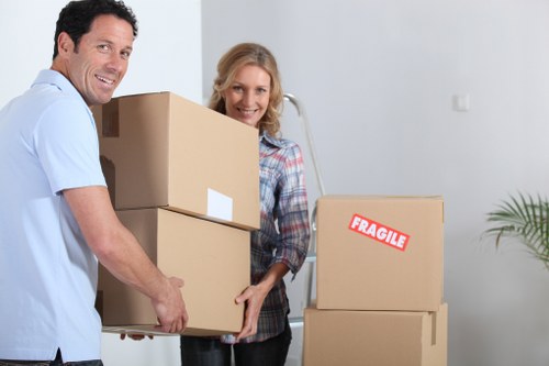 Professional removalists unloading furniture at a new home in Woodside Park
