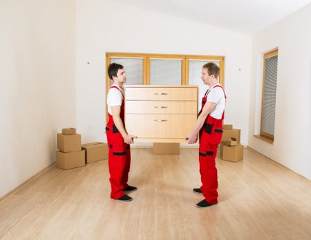 Loading household items into a van for a North London move